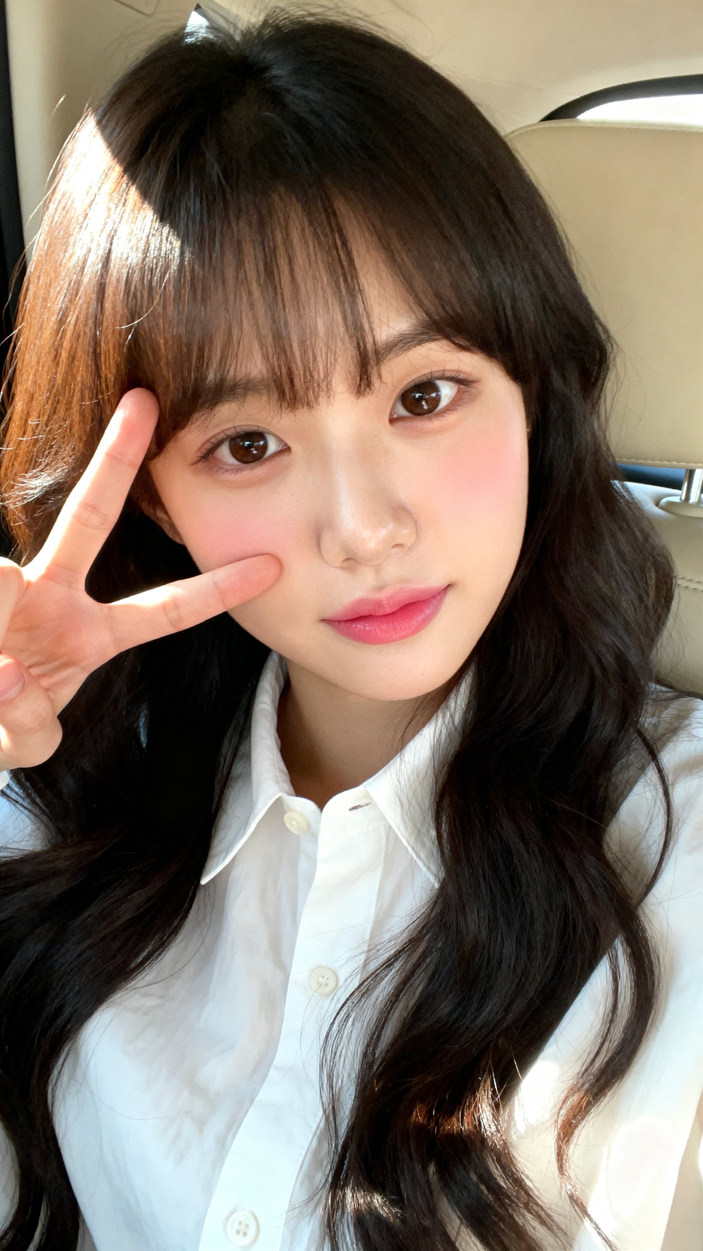 A close-up selfie portrait of a young East Asian woman (Korean appearance) with fair, smooth skin an — AI image prompt — Seedream 5