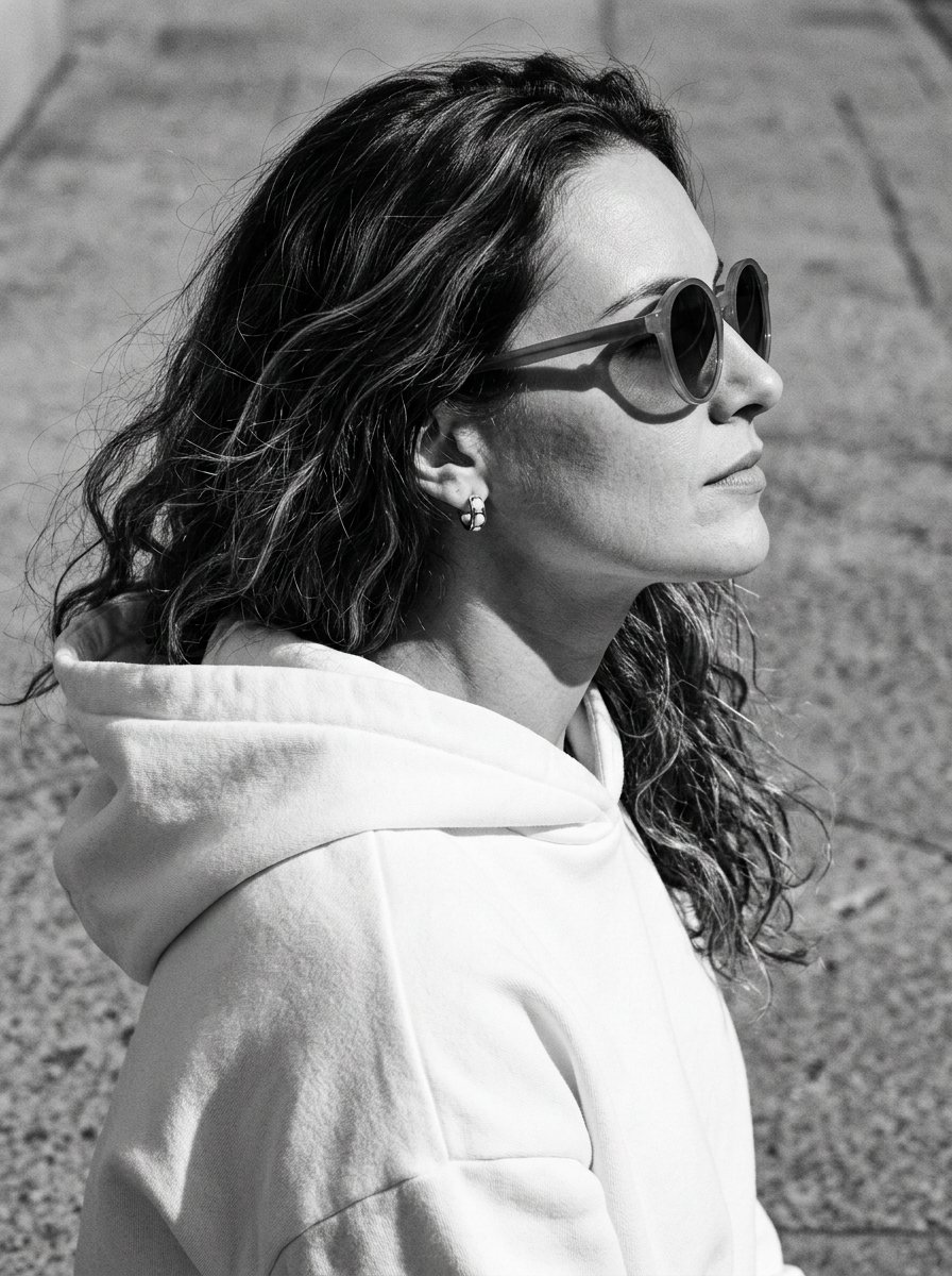 The frame captures her profile turned to the right, with her chin slightly raised, creating a feelin — AI image prompt — Nano Banana